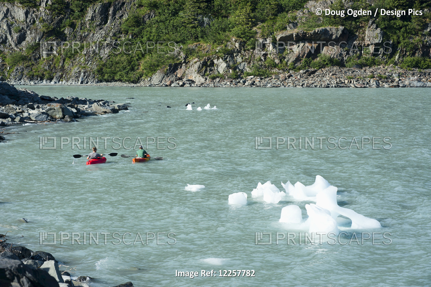 Two Kayakers Avoid Icebergs In The Icey Waters Of Portage Lake, Southcentral ...