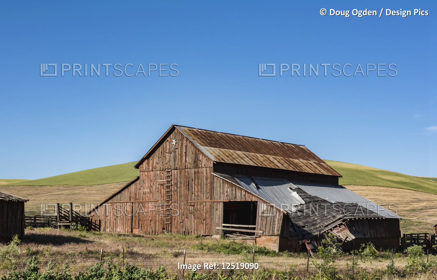 An old, decrepit barn with a failing roof, Eastern Washington; Dayton, ...