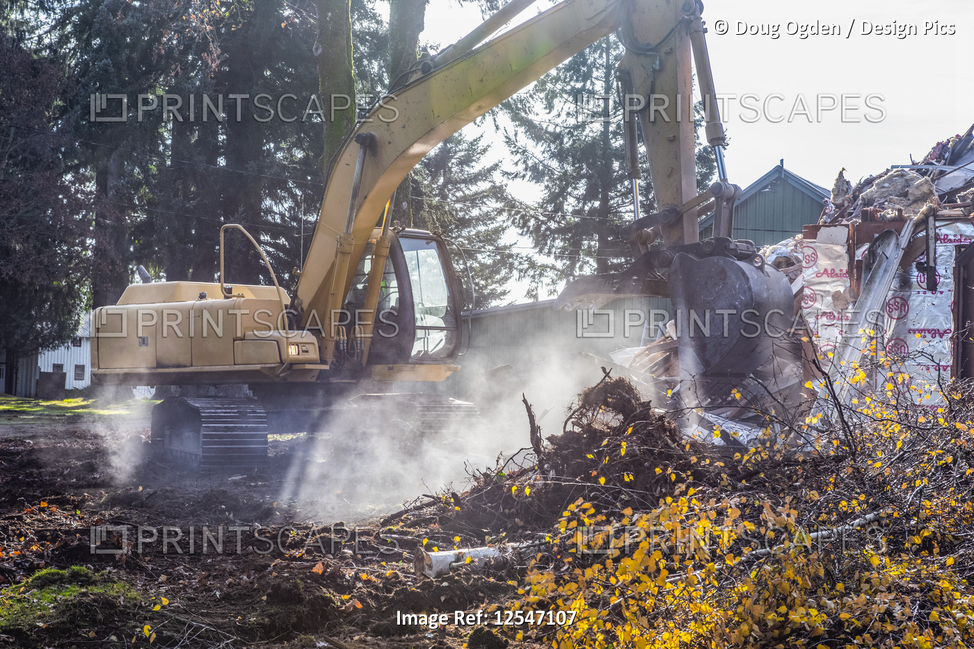 An excavator tears down an old farmhouse reducing it to rubble; Olympia, ...