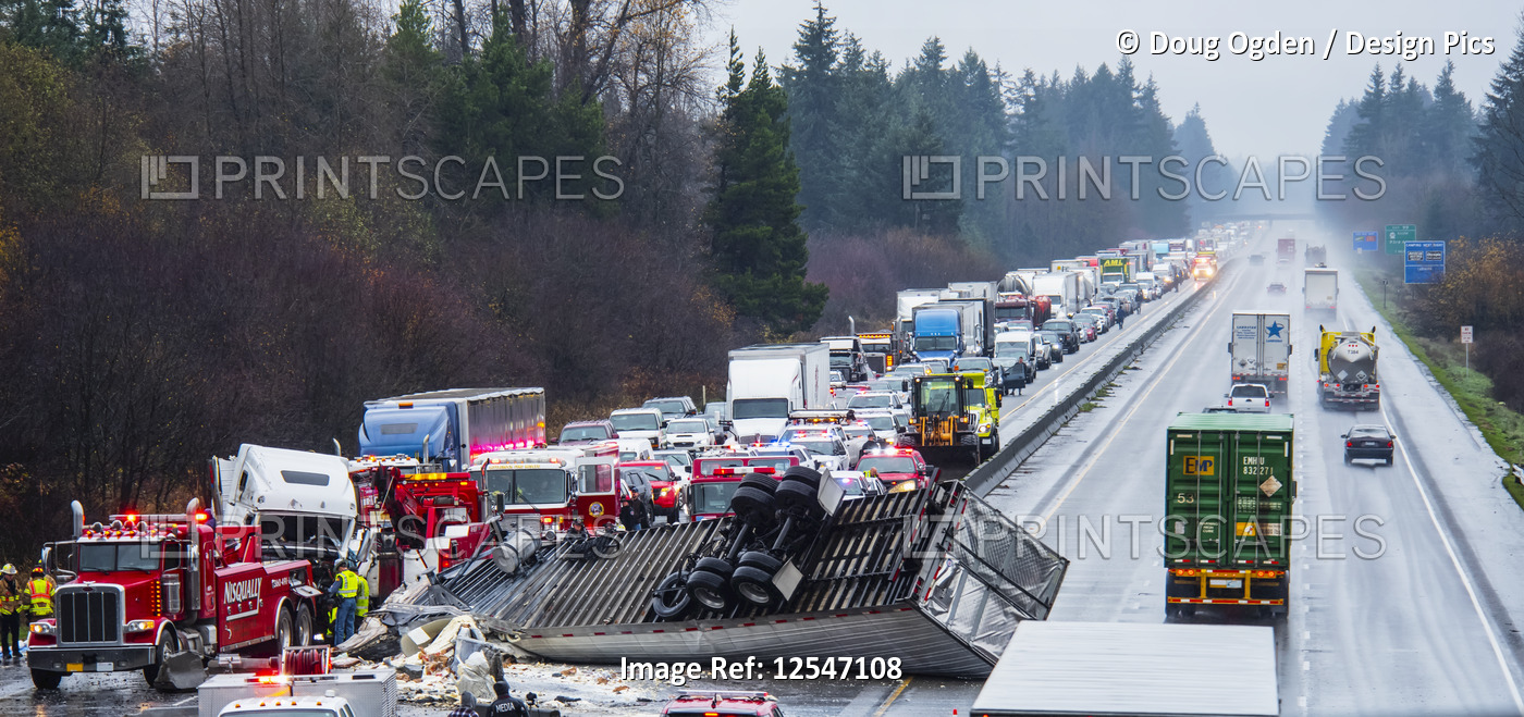 A truck and trailer jumped the centerline jersey barrier during a rainstorm ...