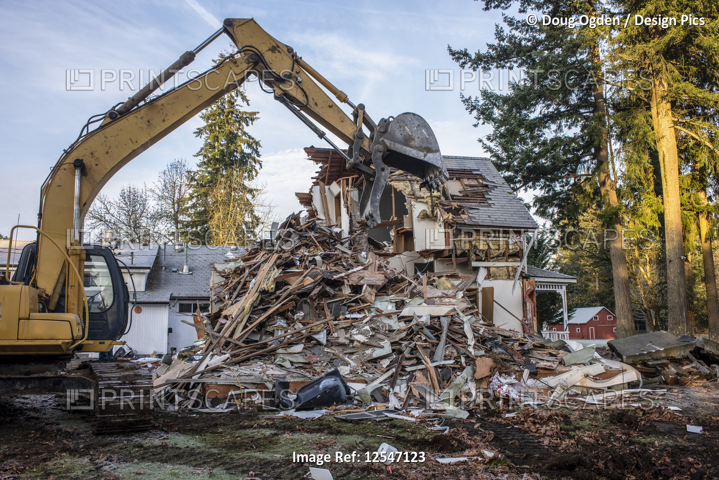 An excavator tears down an old farmhouse reducing it to rubble; Olympia, ...